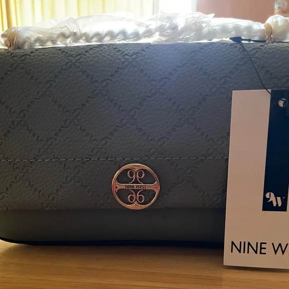 Nine West
Kyelle Flap Embossed Mini Crossbody Bag - Picture 8 of 8